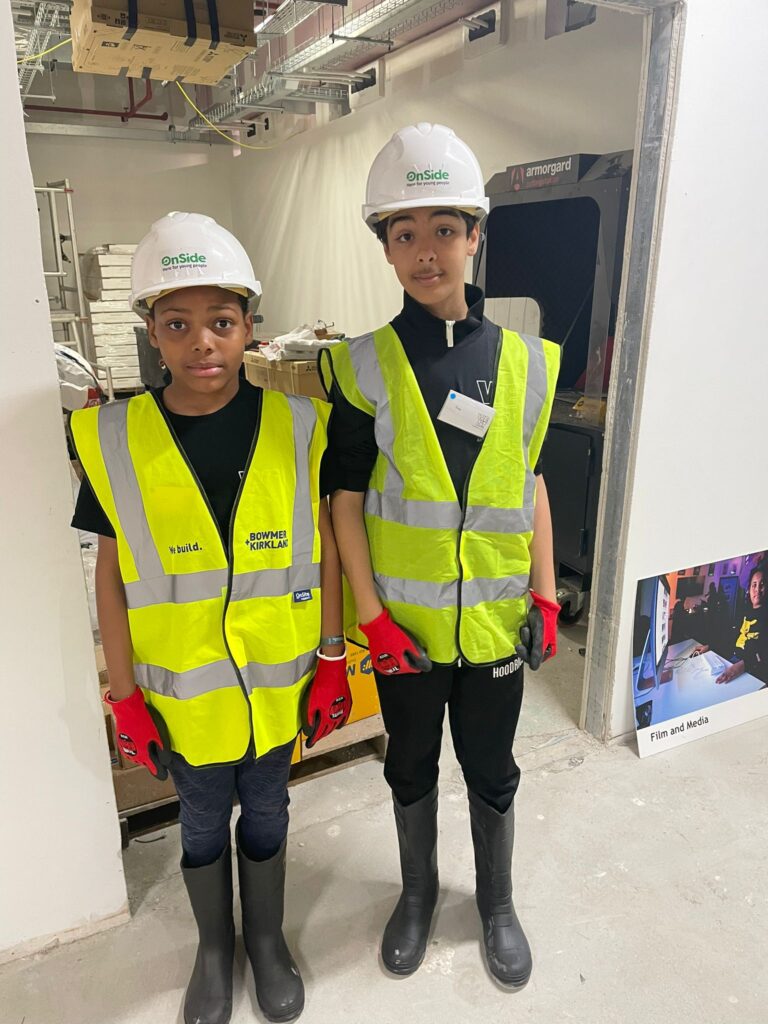 Two members of WEST'S Young People's Development Group visiting the site at the WEST First Look Fundraiser event